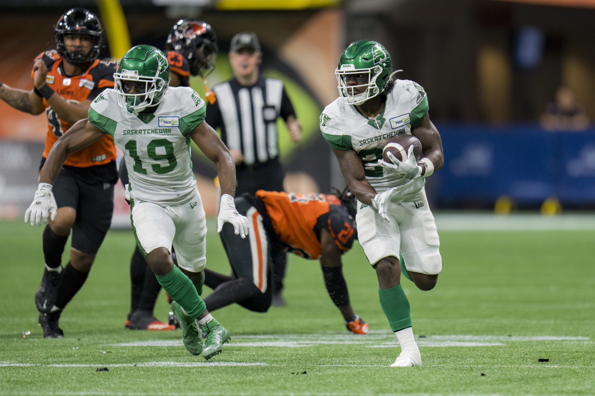 Aug 26, 2022; Vancouver, British Columbia, CAN; Saskatchewan Roughriders wide receiver Samuel Emilus (19) and running back Frankie Hickson (20) run upfield against the BC Lions in the second half at BC Place. Mandatory Credit: Bob Frid-USA TODAY Sports